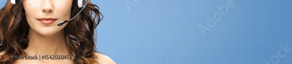 Fototapeta Closeup image. Representative call center. Businesswoman woman support phone operator in headset isolate blue background. Callcenter customer service. Sale agent. Banner image with free text space