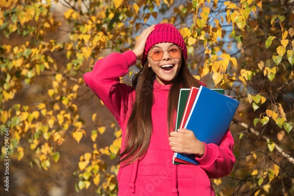 Obraz school girl study in autumn. education in modern school. autumn style of teen girl going to school. knowledge and education. september 1. autumn nature in september. Homework assignments