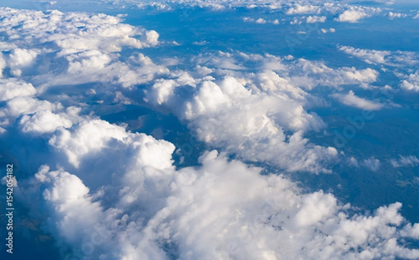 Fototapeta Sky in cloud. Cloudscape with cloudy weather. Cloud and cloudscape aerial sky. Aerial cloudscape view covered with cloud. Aerial cloudy sky view. Cloud view from plane. Cloudy atmosphere
