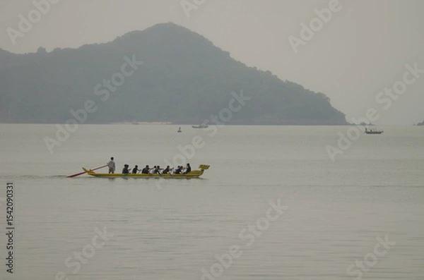 Obraz February 26, 2024, Lan Ha Bay: Rowing boat training. Cat Ba Archipelago. Vietnam.