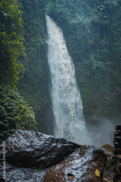 Obraz Nungnung Waterfall Hidden in the Tropical Jungle of Bali, Indonesia