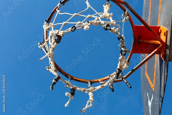 Obraz Basketball hoop with damaged net under blue sky