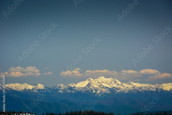 Fototapeta Breathtaking view of snow capped mountain range from Montana ski resort