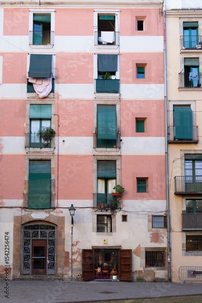 Obraz Narrow street with catalan flags flying in barcelona's gothic quarter