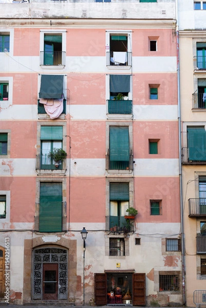 Obraz Narrow street with catalan flags flying in barcelona's gothic quarter
