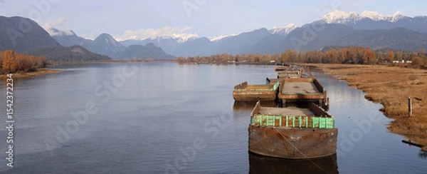 Obraz Barges sleeping on the river from snowy mountains