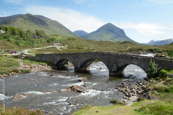 Fototapeta The peak of Sgurr nan Gillean poking out from the beneath the clouds, part of the Cuillin mountain range, viewed from the A87 road, in the Isle of Skye, Scotland, UK
