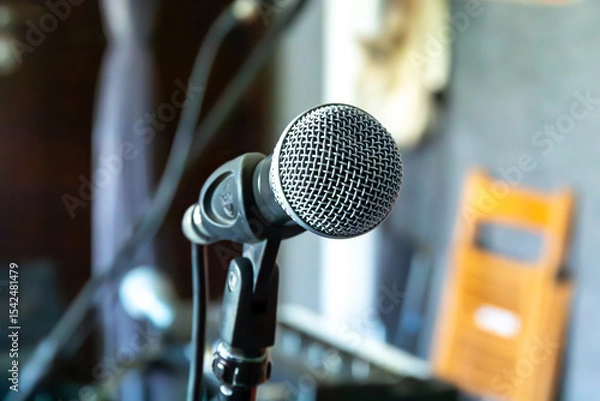 Fototapeta Close-up of a microphone in a home studio setting ready for a recording session