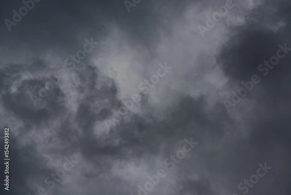 Obraz dramatic mystical stormy sky with thick gray textured clouds. artistic photo for original background, backdrop, layout or decoration