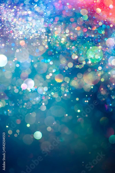 Fototapeta Rainbow of sparkling glitter creating mystical and vibrant spectrum of colors. Dreamy or magical shimmering particles glowing in a bokeh of lights. Ethereal aura with vivid colors abstract background.