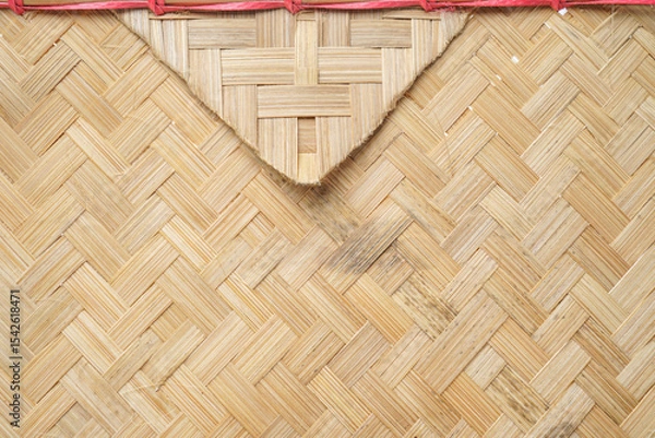 Fototapeta Woven bamboo fan envelope with red string
