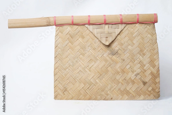 Fototapeta Woven bamboo fan envelope with red string