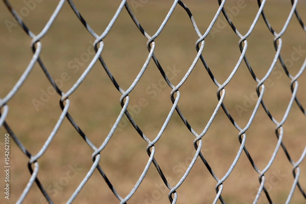 Fototapeta Close-up of a metal chain link fence abstract background