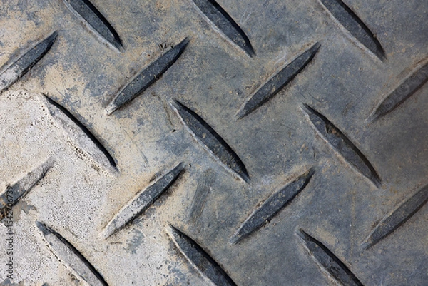 Fototapeta Weathered metal diamond plate close-up abstract background texture