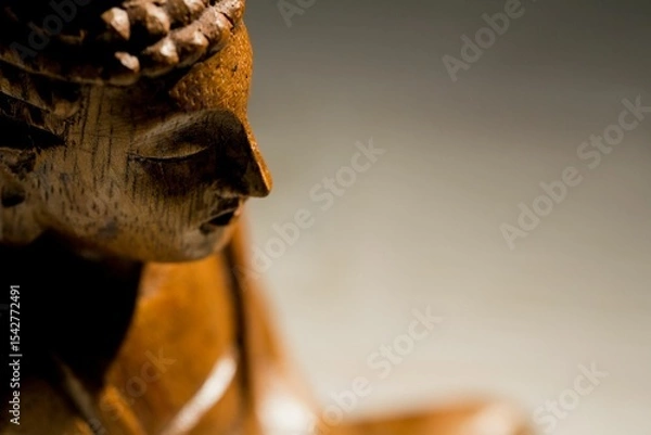 Obraz Close-up of wooden Buddha statue on floor