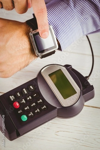 Obraz Man using smart watch to express pay