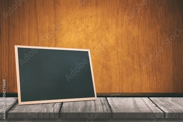 Obraz Black board on a wooden table