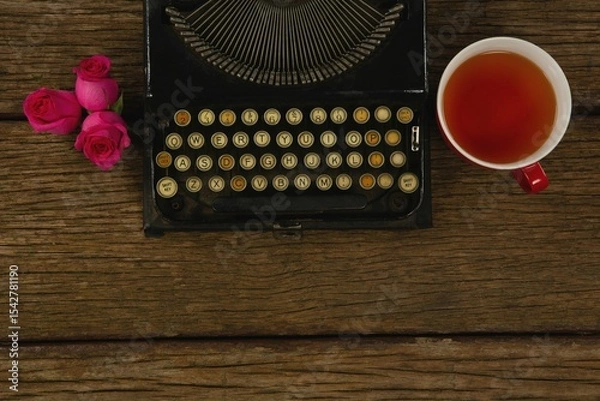 Obraz Typewriter, flowers and lemon tea on table