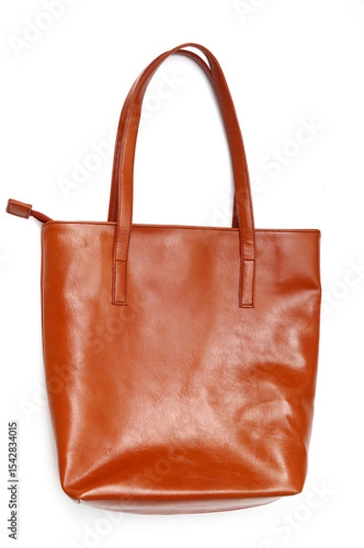 Obraz Woman's light brown leather tote bag isolated on white background. Modern bag 