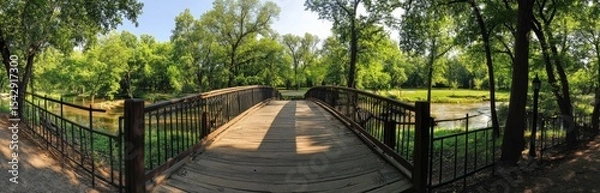 Fototapeta Tranquil park bridge with lush greenery