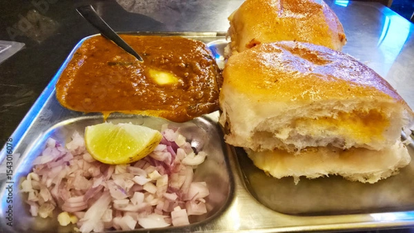 Fototapeta Indian Pav Bhaji with onion, lemon and pav