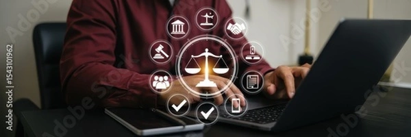 Fototapeta Person working on a laptop with legal icons overlaid.