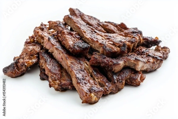 Fototapeta Grilled goat meat strips presented on a clean white background showcasing smoky char marks and delicious texture