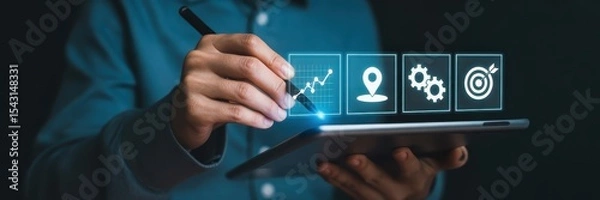 Fototapeta Person using a tablet with digital icons for growth, location, and goals.
