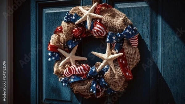 Fototapeta A close up of a handmade wreath decorated with stars and stripes for the fourth of July.