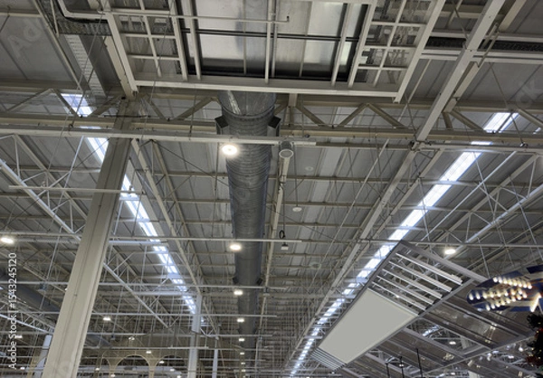 Fototapeta Industrial Ceiling with Metal Structures and Ventilation Ducts