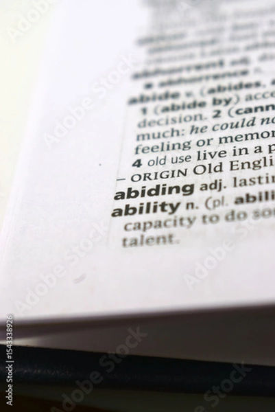 Fototapeta Close Up Of English Dictionary Page With Word - Abiding