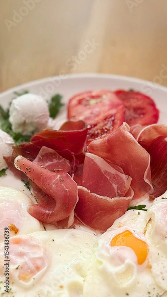 Obraz Fried Eggs with Prosciutto served on a plate