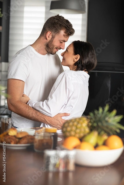 Obraz Couple hugging in kitchen