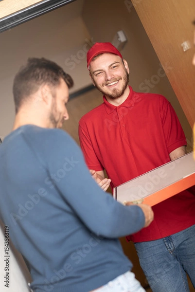 Obraz Man receiving pizza delivery