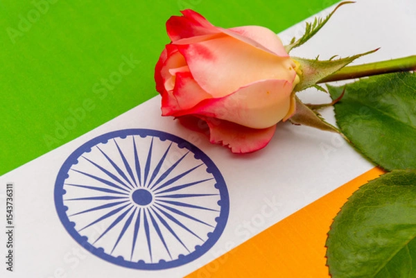 Obraz Emotional image: a rose on the tricolour of India, suitable for Independence Day, Republic Day and memorial themes.