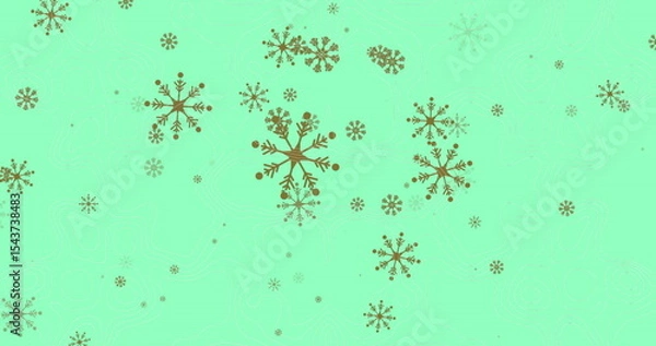 Fototapeta Sparkling gold snowflake motifs covering mint-green background, creating festive abstract pattern