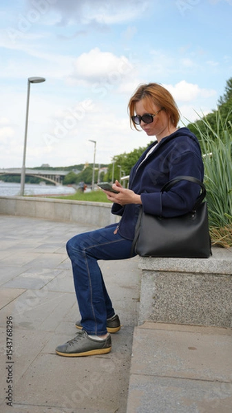 Obraz Close-up of a young woman with a phone24