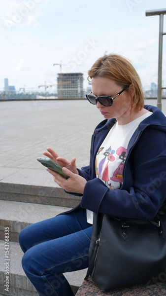 Fototapeta Close-up of a young woman with a phone27