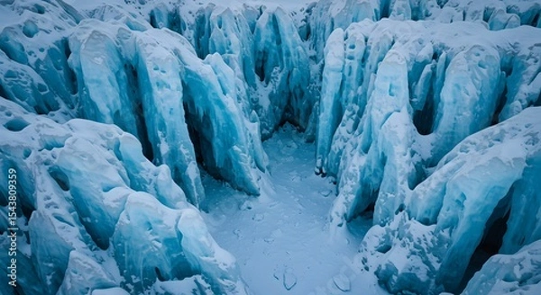 Fototapeta Narrow path through massive glacier formations