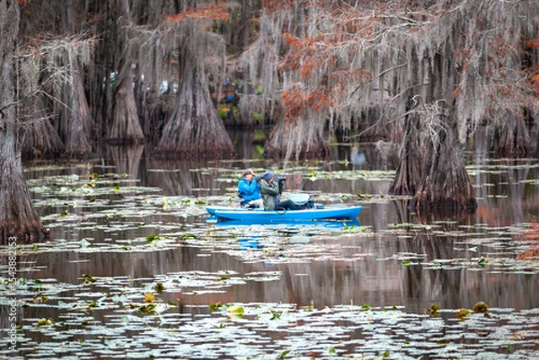 Obraz swamp photographer in boat
