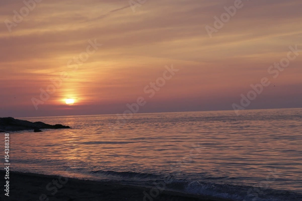 Fototapeta Colorful sky and the sea reflected in sunset. sunset on the sea with the sky in the clouds Turkey beach