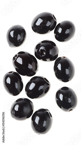 Fototapeta Heap of Shiny Picked Black Olives Floating Isolated on a White Background