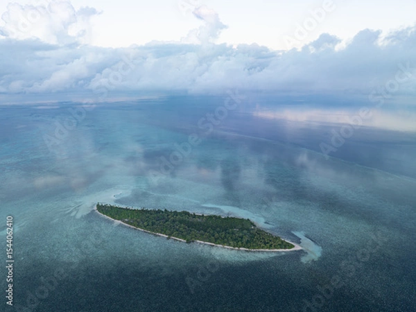 Obraz Evening light illuminates an island within Wakatobi National Park, off the coast of Sulawesi. This area is a popular destination for divers and snorkelers due to its high marine biodiversity.