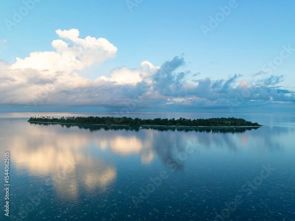 Obraz Evening light illuminates an island within Wakatobi National Park, off the coast of Sulawesi. This area is a popular destination for divers and snorkelers due to its high marine biodiversity.