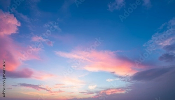 Fototapeta sky in the pink and blue colors effect of light pastel colored of sunset clouds cloud on the sunset sky background with a pastel color
