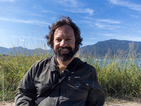 Obraz Very happy millennial man playing with his drone on a mountain at 40 years old