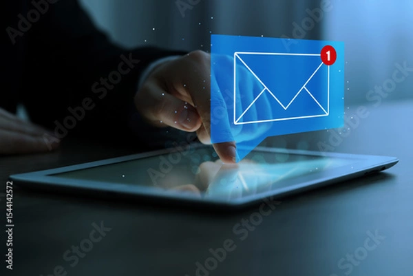 Obraz Email marketing, new message notification. Man using tablet computer at table indoors, closeup