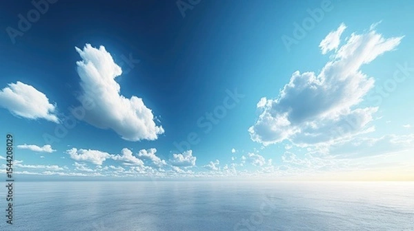 Obraz Vast expanse of a placid sea, scattered cumulus clouds, clear azure sky