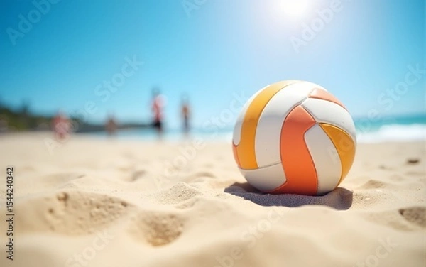 Fototapeta Focused ball on the beach sand, beach volleyball game under sunlight and blue sky blurred background. High quality