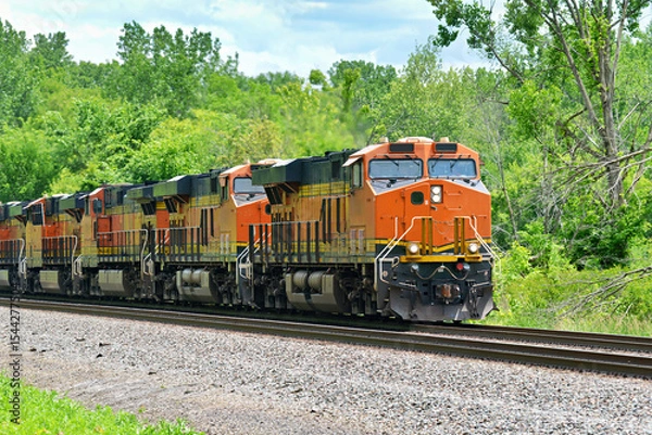Obraz A string of Diesel locomotives pulling a freight train